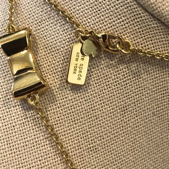 KATE SPADE Gold Tone Gold Enamel Bow Long Necklace - Picture 4 of 14